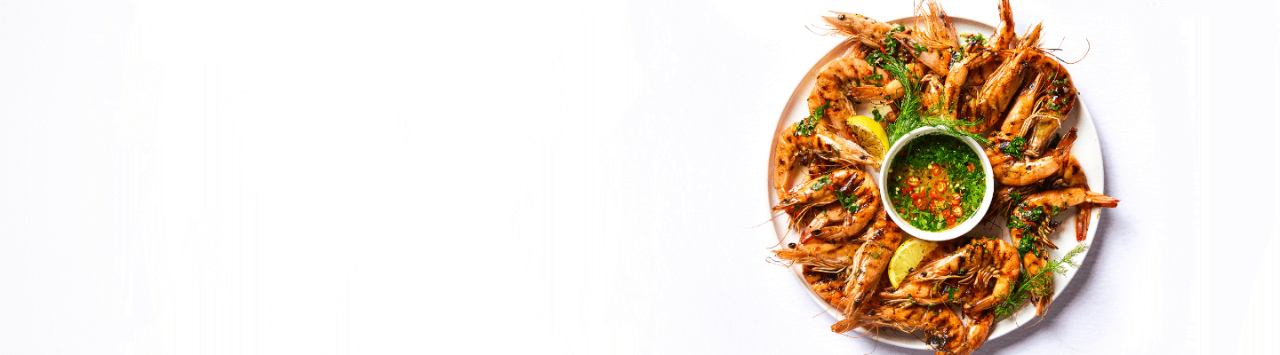 Grilled Prawns with a Chilli and Herb Vinaigrette recipe from Checkers Africa, perfect for those seafood enthusiasts.