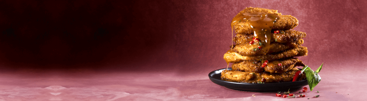 Hot Honey Butter Chicken Schnitzels recipe made with Crispy Cuts Crumbed Chicken Schnitzels for Checkers Africa.