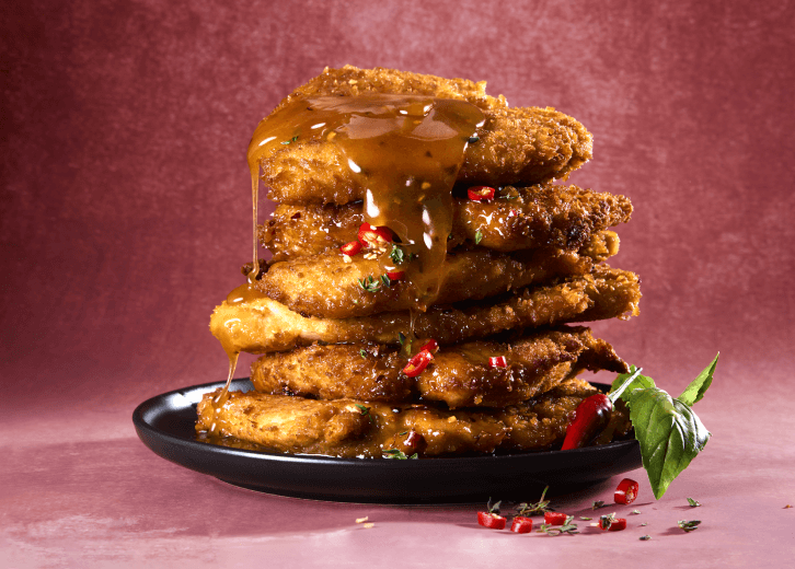 Hot Honey Butter Chicken Schnitzels recipe made with Crispy Cuts Crumbed Chicken Schnitzels for Checkers Africa.